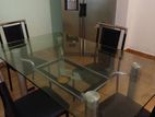 A Dining Table With 4 Chairs