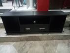 Black colour TV stand with setup cupboard (55")