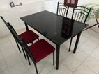 Dining Table with Four Cushion Chairs