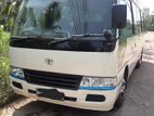 Coaster AC 27 Seater Bus for Hire