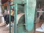 Coconut husk cutting machine