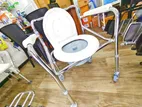 Commode chair with wheel