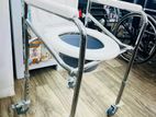 Commode chair with wheel
