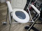 Commode chair with wheel