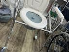 Commode chair with wheel
