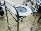 Commode chair with wheel