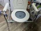 Commode chair with wheel