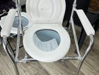 Commode chair with wheel