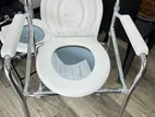 Commode chair with wheel