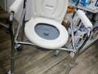 Commode chair with wheel
