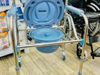 Commode chair with wheel