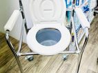 Commode chair with wheel