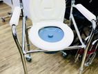 Commode chair with wheel