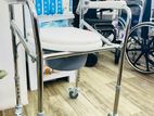 Commode chair with wheel