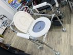 Commode chair with wheels
