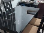 Glass Covered Dining Table with Chairs