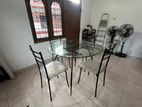 Glass table with 4 chairs