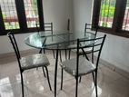 Glass table with 4 chairs