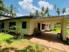Land in Mirigama -Overlooking a Paddy Field With Old House - Meerigama