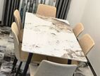 luxury granite dining table with cushion chairs