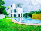 Luxury Villa with Elegant Lighting in Bulathsinhala, Sri Lanka"-