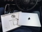Apple Macbook Air M2 with Magic Mouse.
