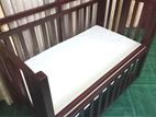 Mahogany Foldable Baby Cot.