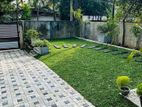 Malaysian Garden Grass with Interlock Paving