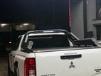 Mitsubishi Triton 2025 Hamer Electric Roll Shutter & Night Fury Bar