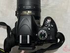 Nikon D5100 camera with AF-S DX Nikkor 18-55mm f/3.5-5.6G