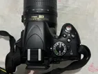 Nikon D5100 camera with AF-S DX Nikkor 18-55mm f/3.5-5.6G