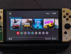 Nintendo Switch OLED - The Legend of Zelda edition with 3 games.