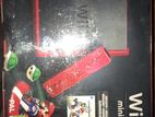 Nintendo Wi mini red with Mario kart