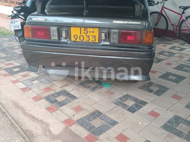 Nissan B11 1985 photo 2