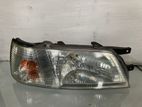 Nissan Bluebird EU14 Head Lamp