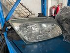 Nissan N16 Headlight (upper brkt dmg)