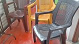 Plastic arm chairs