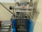 Powder packing machine with elevator