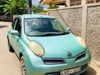 Rent a car -l Nissan March Beetle Auto .