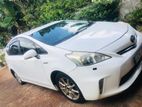 Rent a car - Toyota Prius { Alpha } .