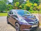 Rent Honda Fit hybrid with rental insurance
