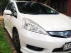 Rent Honda Fit shuttle Hybrid - TOURMI