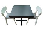 Single base table with two cafe chairs