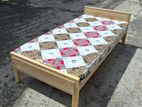 single wooden bed with mattress