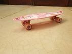 Small Pink Plastic Skateboard