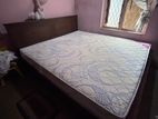 Teak bed with spring mattress