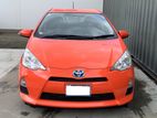Toyota Aqua Orange Colour Car for Rent