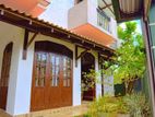 Two-Story House with Roof Terrace for Sale in Athurugiriya