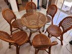 Used Cane Table with Glass Top and 6 Chairs