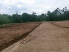 Valuable plots for sale facing Mawak Oya near Padukka town